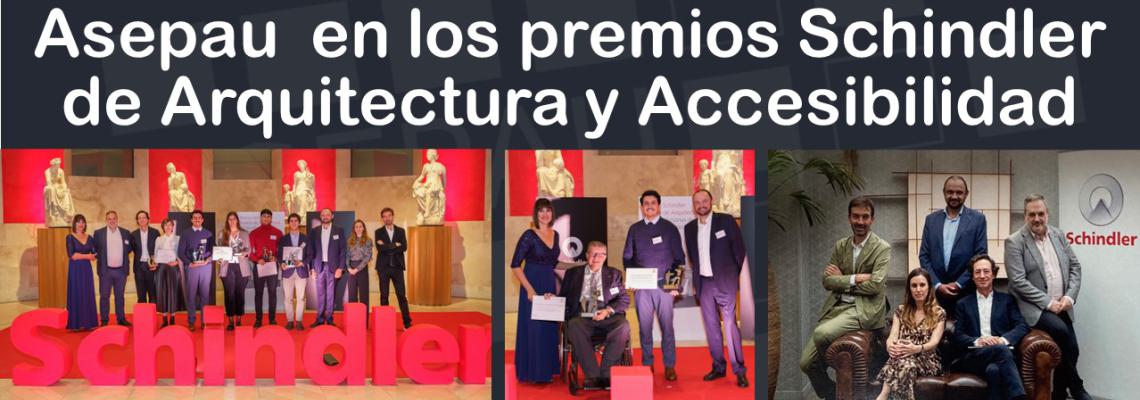 Imagen general de los premiados y el jurado con rótulo de Schindler y fondo de esculturas